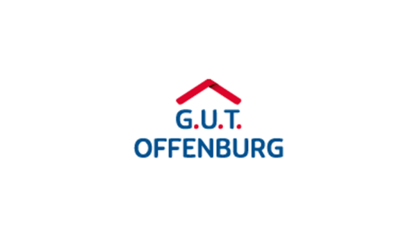 Logo von G.U.T Offenburg mit dunkelblaue Schrift und rotem Dach über den drei Großbuchstaben G.U.T.